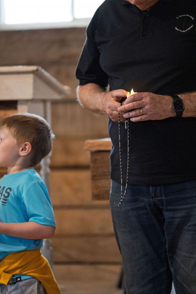 Man praying the rosary