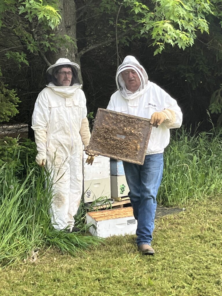 Beekeepers at Lumen Christi Farm